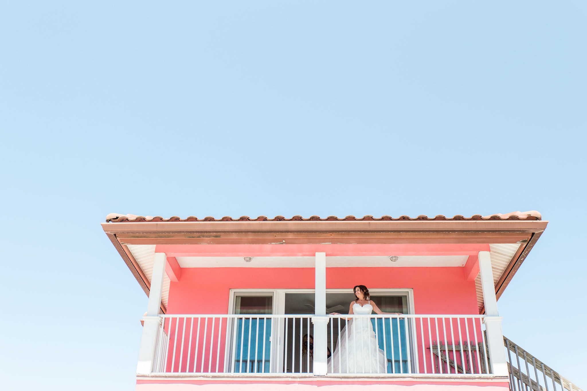 bride on balcony at tropical breeze resort