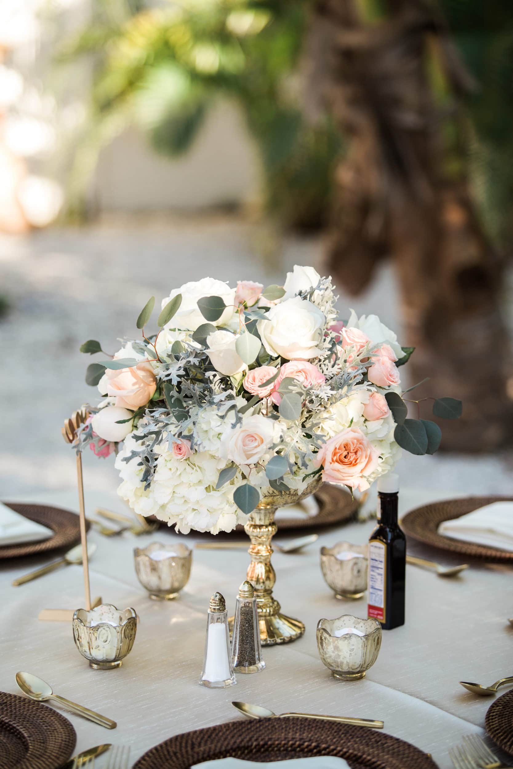 white and light pink floral centerpiece