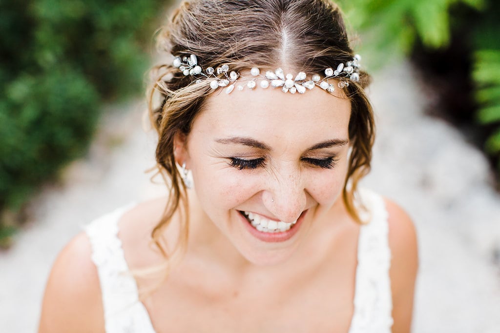 bride laughing with beaded headpiece at tropical florida keys wedding