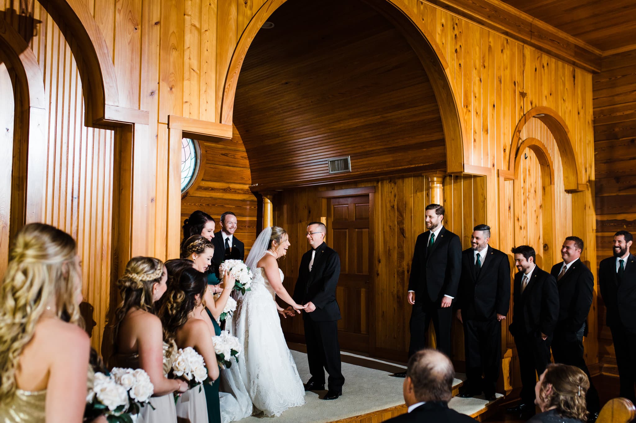 bride and groom exchanging vows on the altar of the wedding chapel at the estate on the Halifax