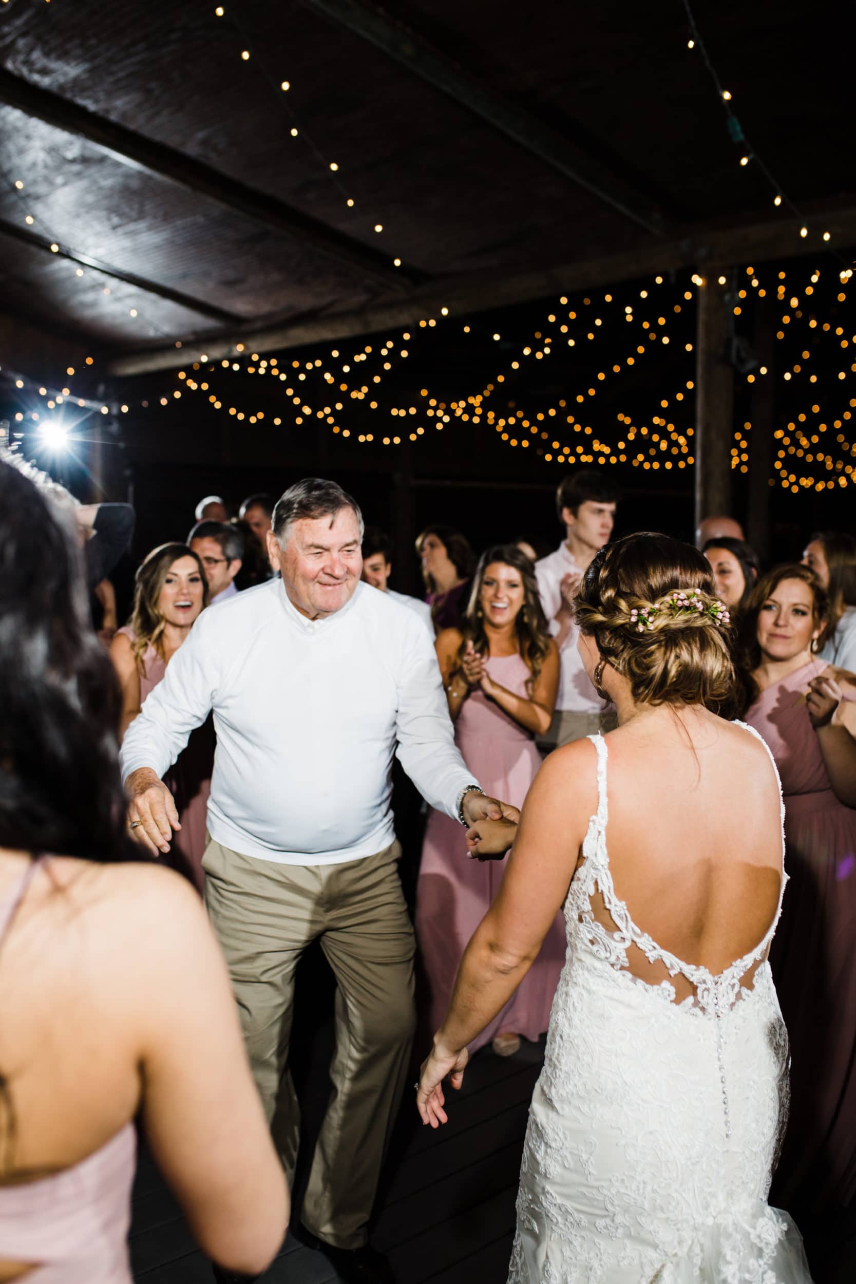 grandfather dancing with bride at paradise cove
