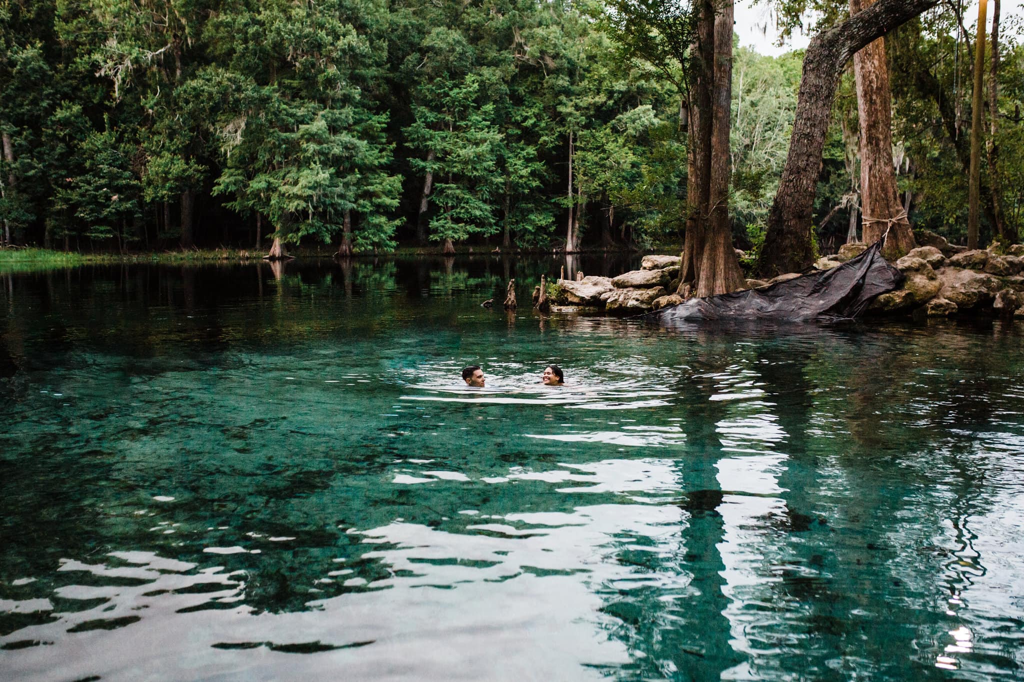couple swimming in blue water at Ginnie Springs