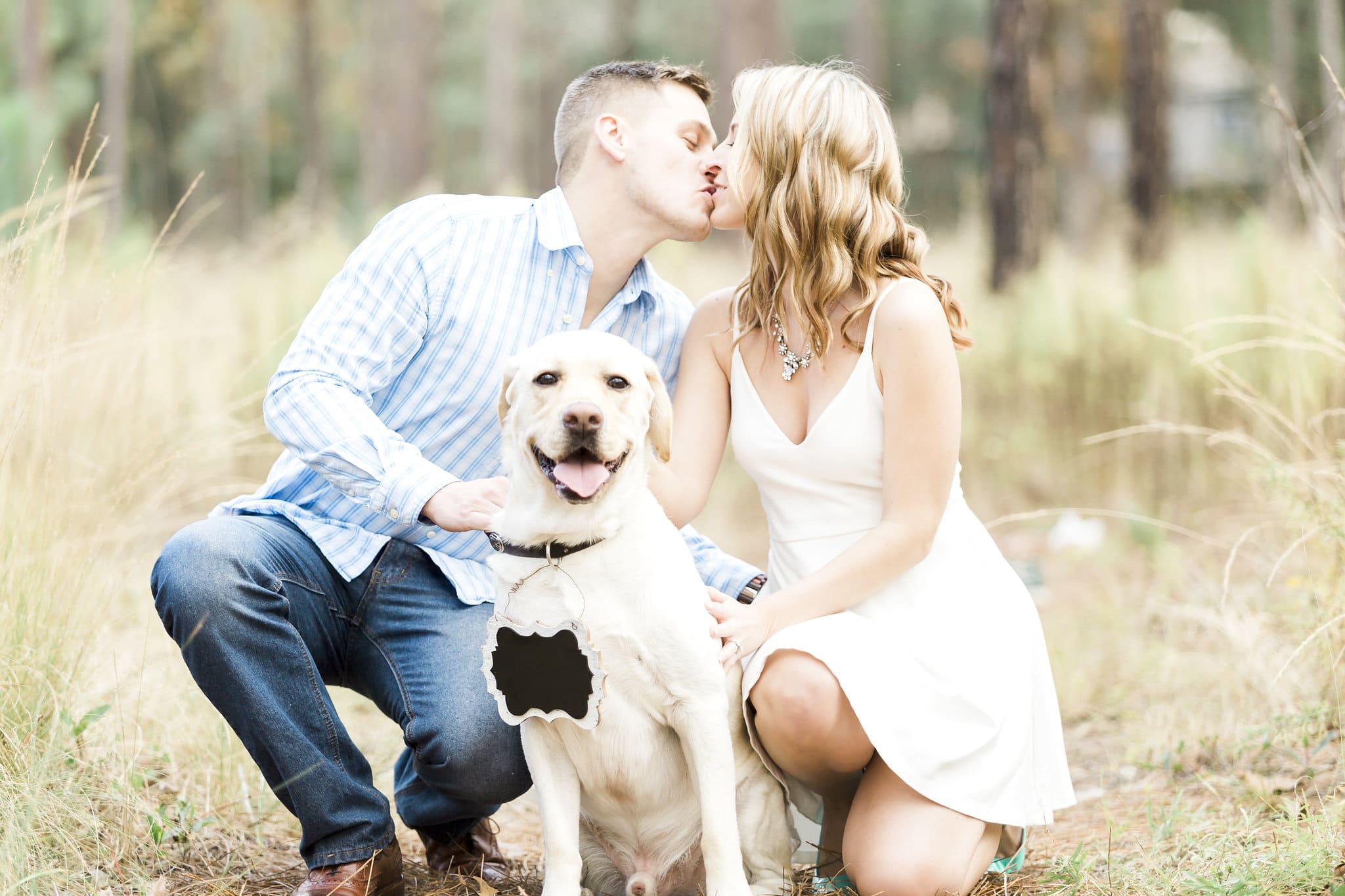 bride to be with white dress with groom to be with blue shirt with yellow lab dog at Wekiwa Springs Engagement Session